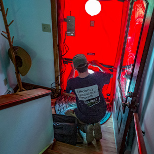 Photo of a contractor speaking with a homeowner about their house